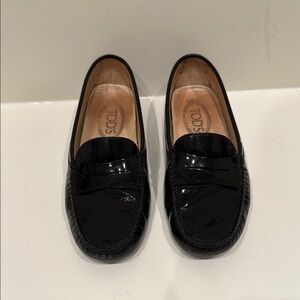 Tod’s Black Patent Leather Loafers